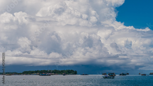 Huge White Clouds above Port in Waisai, Waigeo, Raja Ampat, West Papua, Indonesia photo
