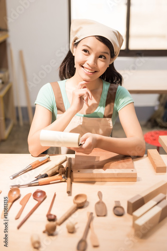 woman woodworking smile happily