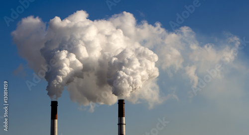 the smoke from the pipe of the plant, the emission harmful gases into the atmosphere, greenhouse efekt