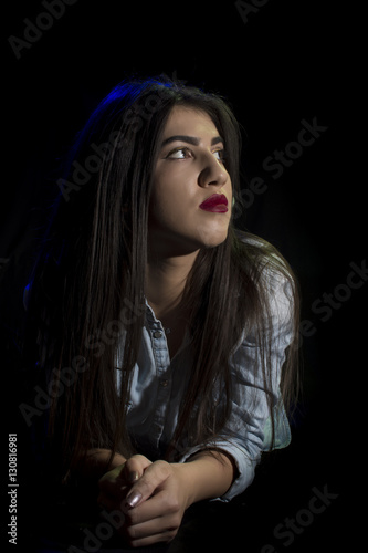 Young woman ,studio portrait on black background © FotoGroupMedia