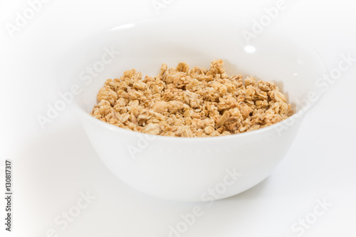Bowl of granola, on white background.