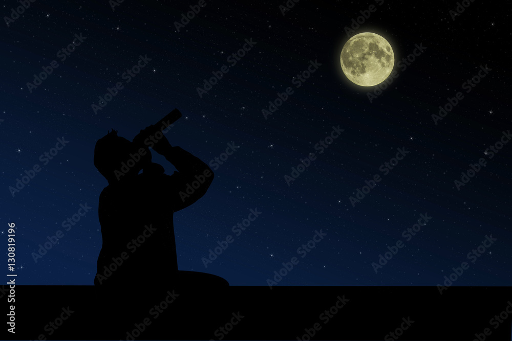 The man sitting on the roof and looks through binoculars at the full moon  night