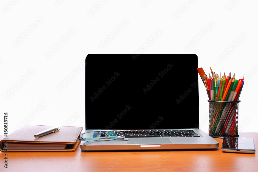 Working space. Laptop, notepad on wooden desk Working space. Laptop, notepad on wooden desk