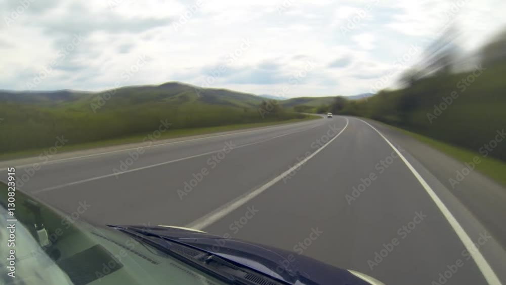 Driving on the highway in the mountains. Point of view camera filming. Time lapse. Driving on the highway in the mountains. Point of view camera filming. Time lapse.