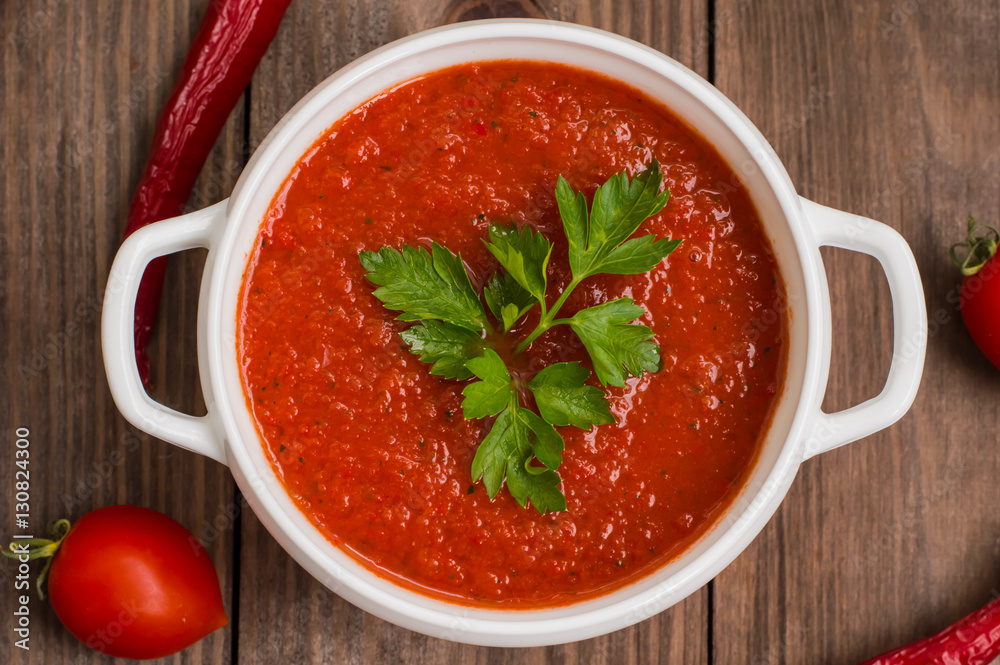 Gazpacho with vegetables. Wooden rustic background. Top view