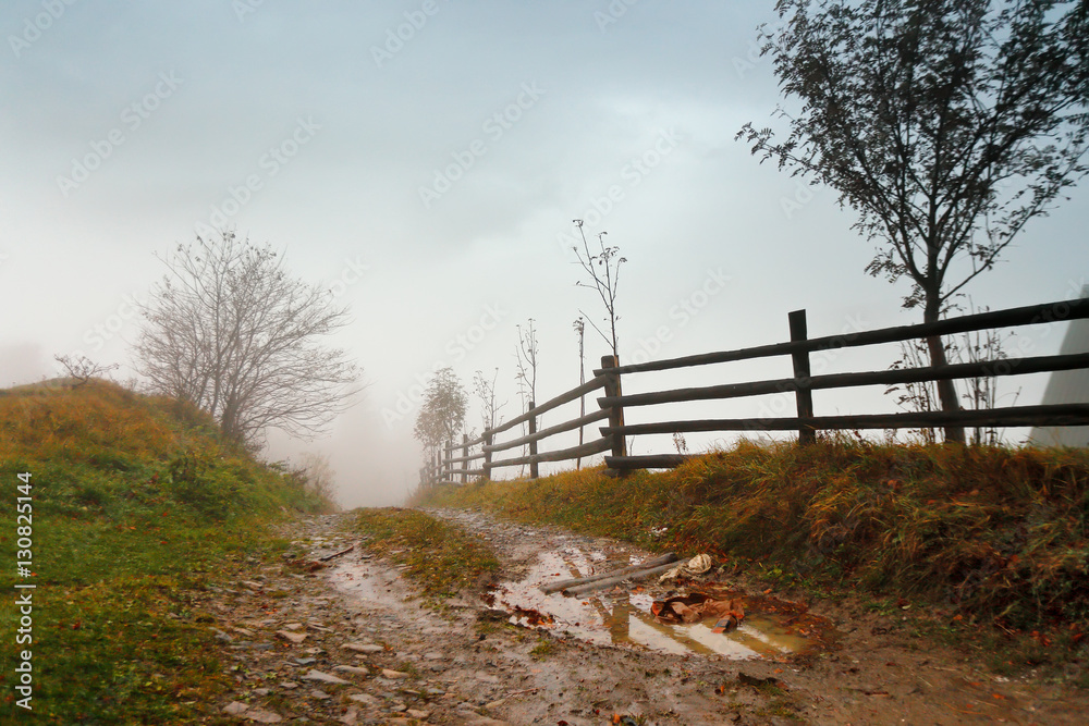 Muddy ground after rain in mountains. Extreme path rural dirt ro