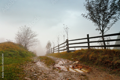 Obraz na płótnie Muddy ground after rain in mountains. Extreme path rural dirt ro w salonie