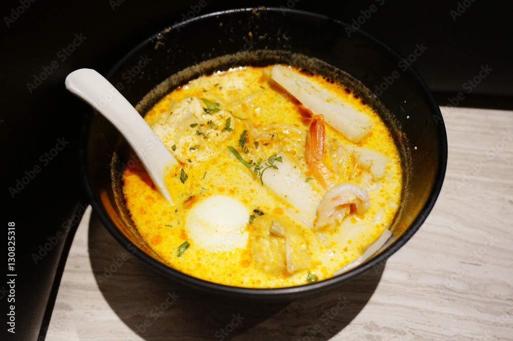 A bowl of hot Malaysian laksa soup