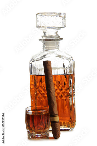 Decanter of whiskey and cigar on a white background