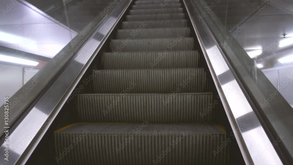 Escalators going up at the underground station Escalators going up at the underground station