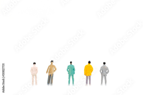 Group of miniature businessman on white background