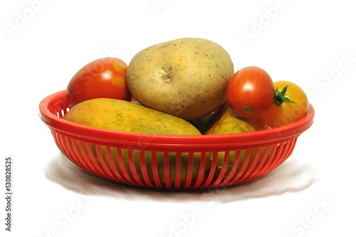vegetables in a red basket
