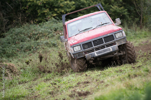 Off road 4x4 car on grass spraying mud up © Nicky Rhodes