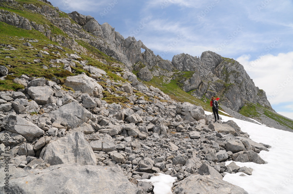 Hiker woman in a rocky trail