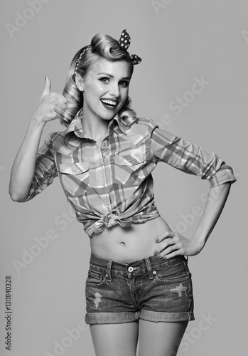 smiling woman, showing thumb up gesture, dressed in pin-up style