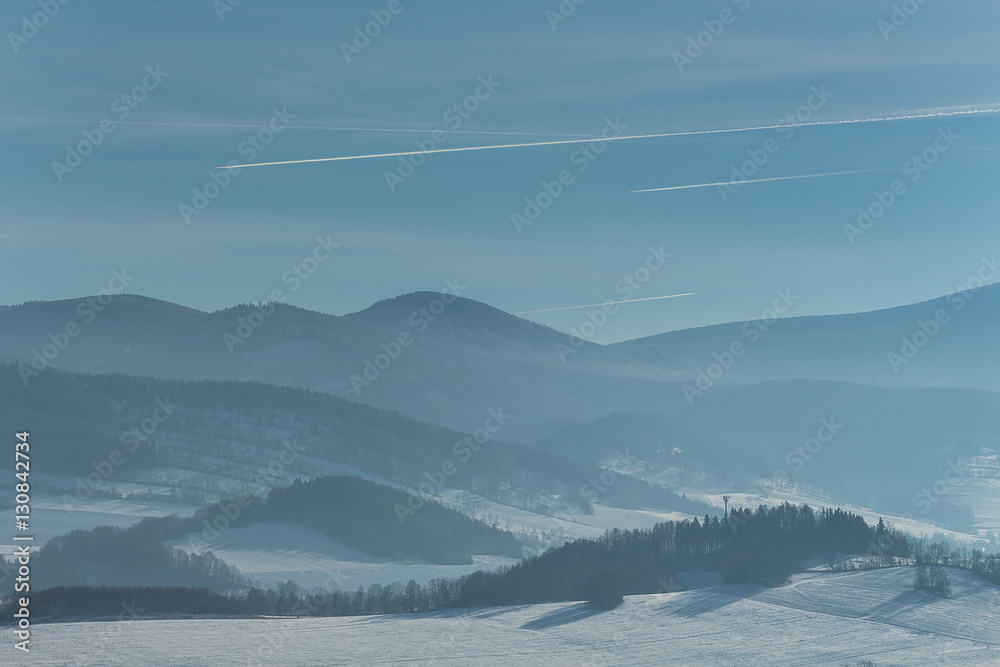 Beautiful winter landscape with fog in the mountains.