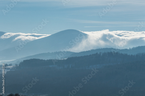 Beautiful winter landscape with clouds in the mountains.