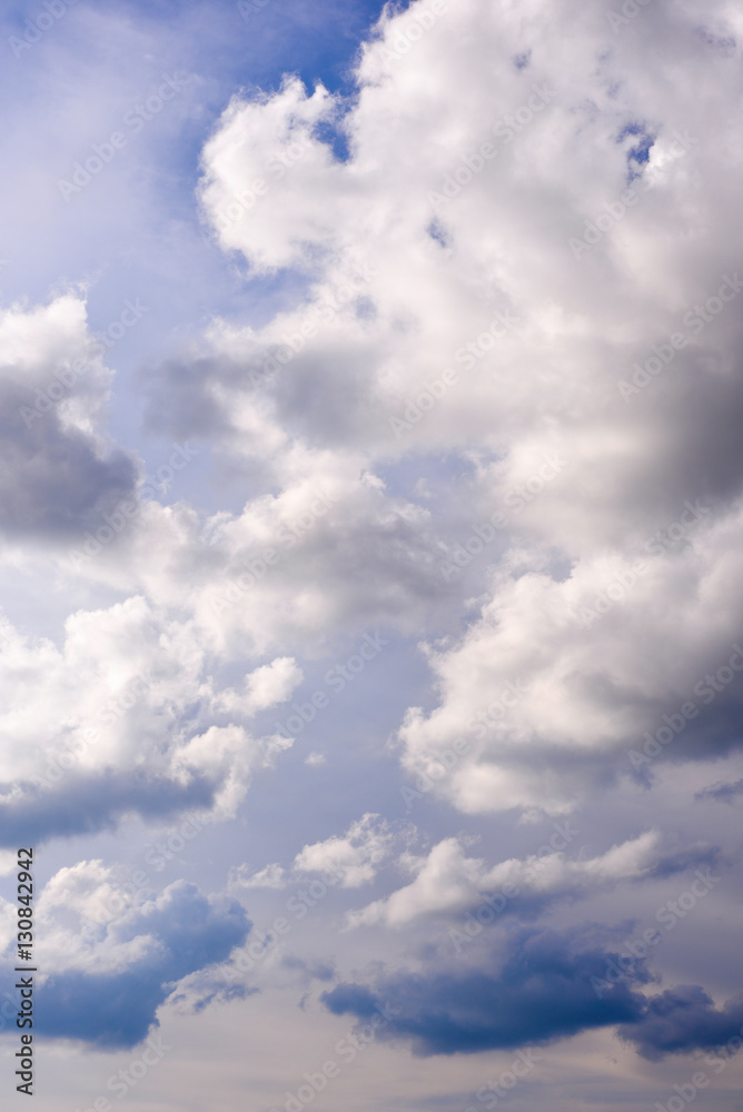 Fototapeta premium Bright dark blue sky with dramatic clouds. Aerial sky and clouds background. Image of white fluffy clouds in the blue sky for background usage