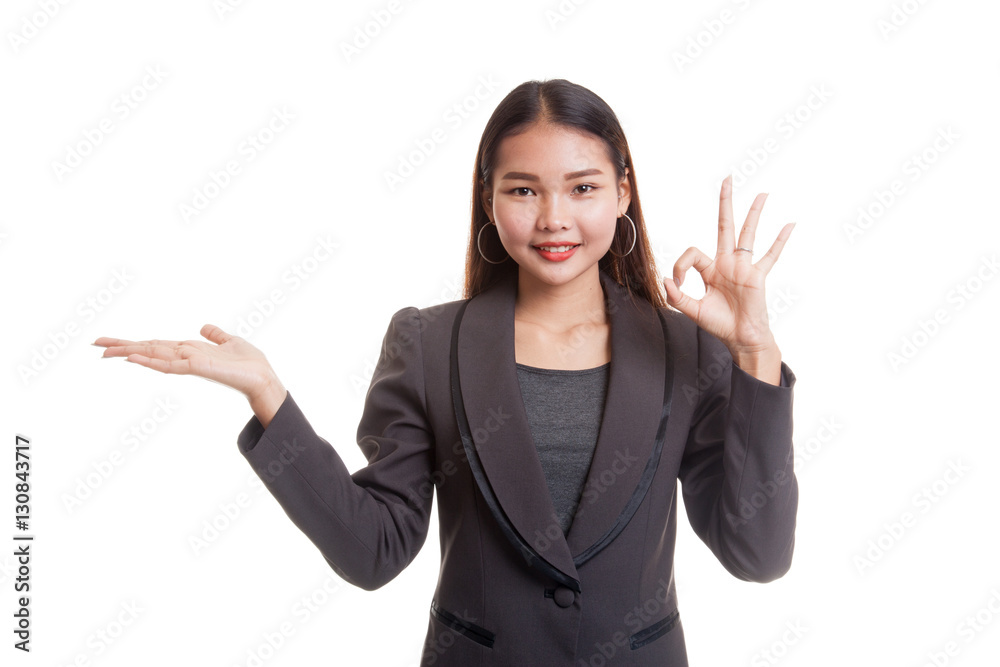 Beautiful young Asian woman show palm hand and OK sign. Beautiful young Asian woman show palm hand and OK sign.