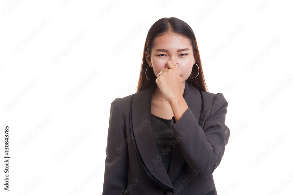 Young Asian woman holding her nose because of a bad smell. Young Asian woman holding her nose because of a bad smell.