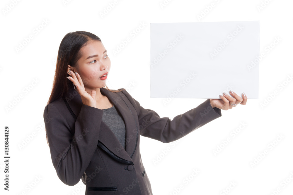 Young Asian business woman surprise with white blank sign. Young Asian business woman surprise with white blank sign.