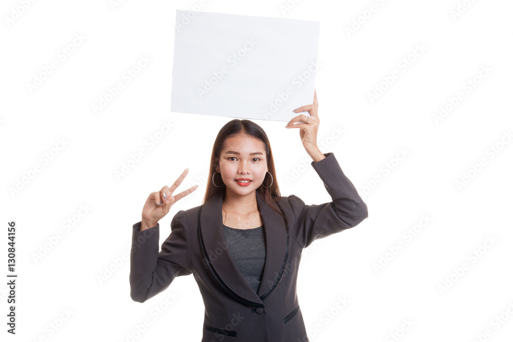 Young Asian business woman show victory sign with blank sign. Young Asian business woman show victory sign with blank sign.