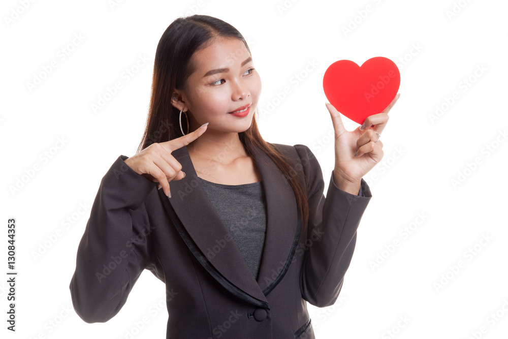 Asian business woman point to red heart. Asian business woman point to red heart.