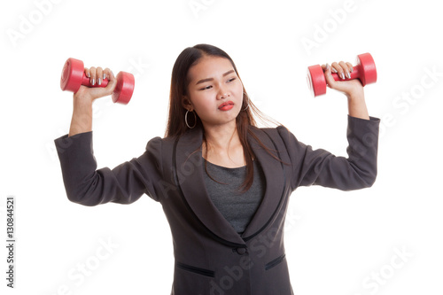 Exhausted Asian business woman with dumbbells.