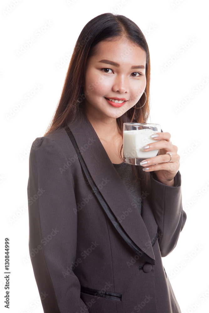 Healthy Asian woman drinking a glass of milk. Healthy Asian woman drinking a glass of milk.