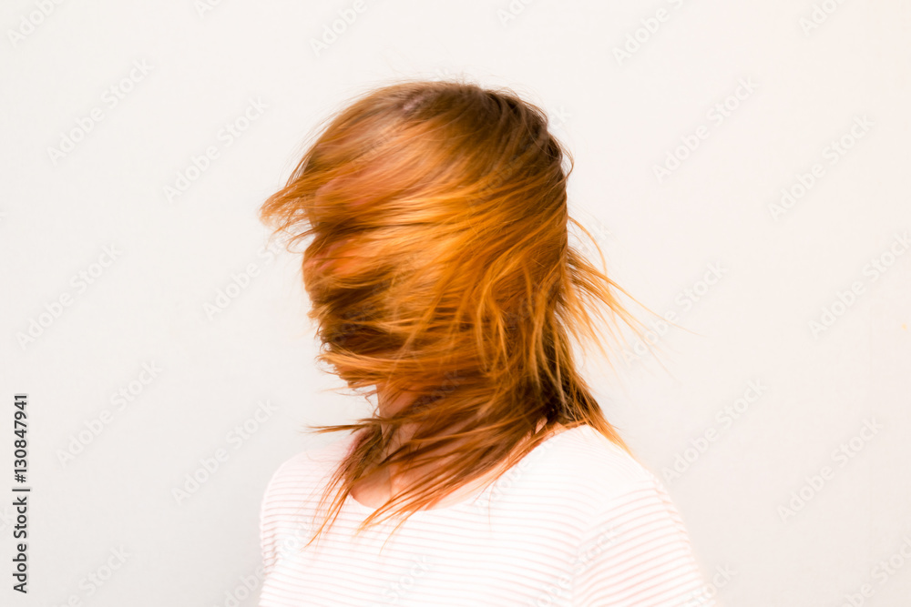 Young beautiful girl with red hair flying Young beautiful girl with red hair flying