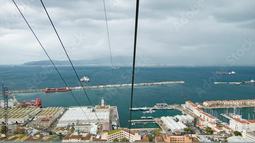 Onboard Gibraltar Cable Car Riding to the Top Upper Rock Nature Reserve looking Over the Bay on a Cloudy Day in the British Overseas Territory