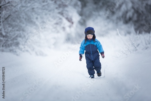 Happy caucasian child playing in snow © milosz_g