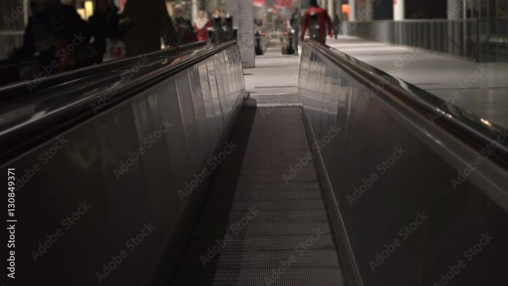 People and escalators at the airport People and escalators at the airport