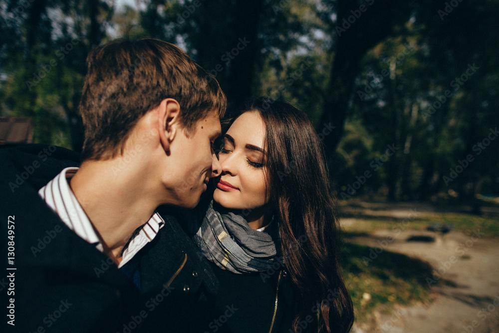 Couple of lovers. Portrait of young couple in love enjoying romantic moment at outdoors. Love story.