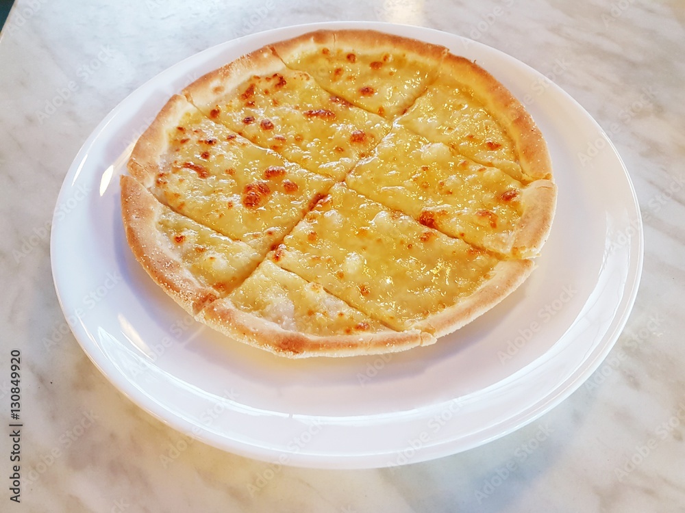 Simple freshly baked and ready to eat hot sliced cheese pizza pie Simple freshly baked and ready to eat hot sliced cheese pizza pie