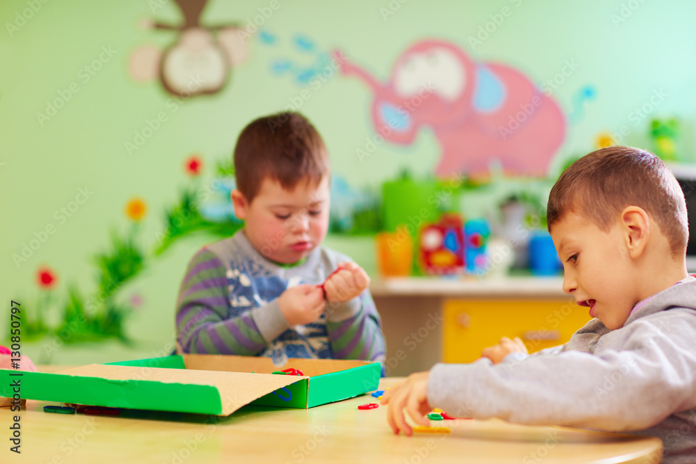kids with special needs develop their fine motility skills in daycare rehabilitation center kids with special needs develop their fine motility skills in daycare rehabilitation center