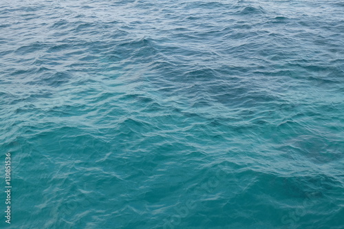 turquoise and blue cloroed water surface on the open sea or a lagoon - medium to light waves