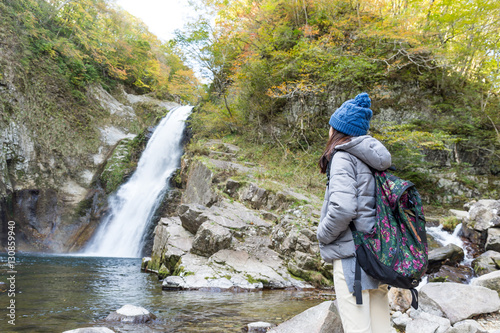 Woman go for hiking in waterfalls