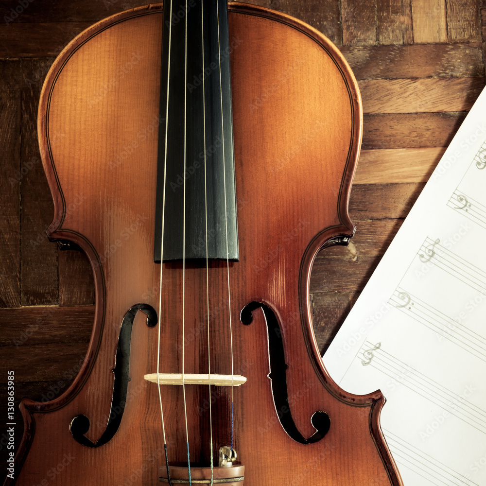 classical violin and blank music sheet on wooden floor for composer concept background classical violin and blank music sheet on wooden floor for composer concept background