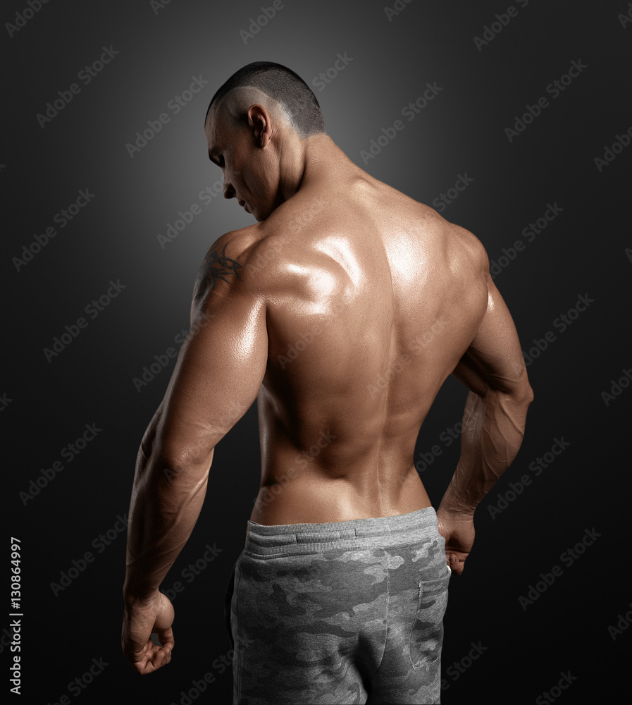 Muscled male model showing his back Stock Photo | Adobe Stock