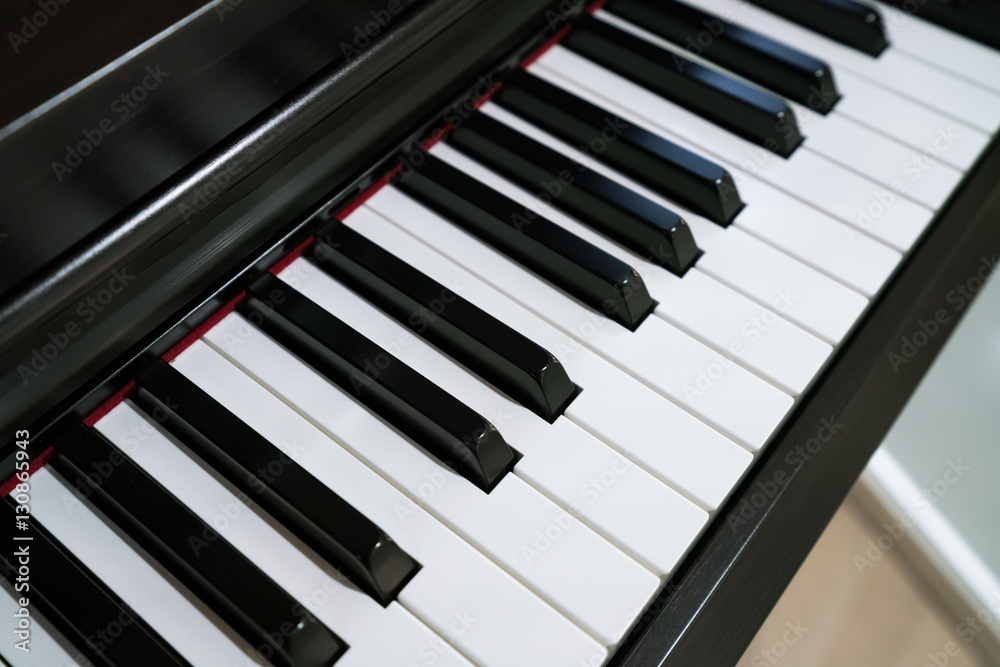 black Piano and Piano keyboard.
Close up shot of grand piano Keys - The New Polished Piano keyboard
black Piano and Piano keyboard.
Close up shot of grand piano Keys - The New Polished Piano keyboard