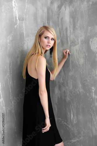 Pretty young woman standing...