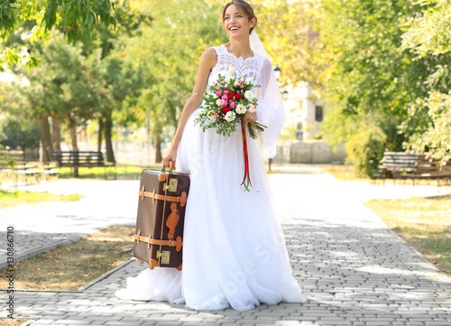 Young bride with bouquet of...
