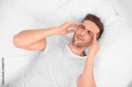 Young man feeling headache ...
