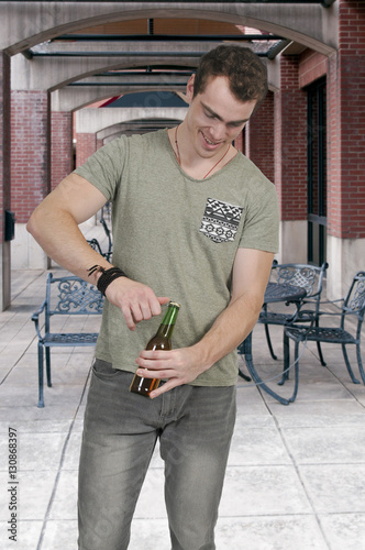 Man opening Beer photo