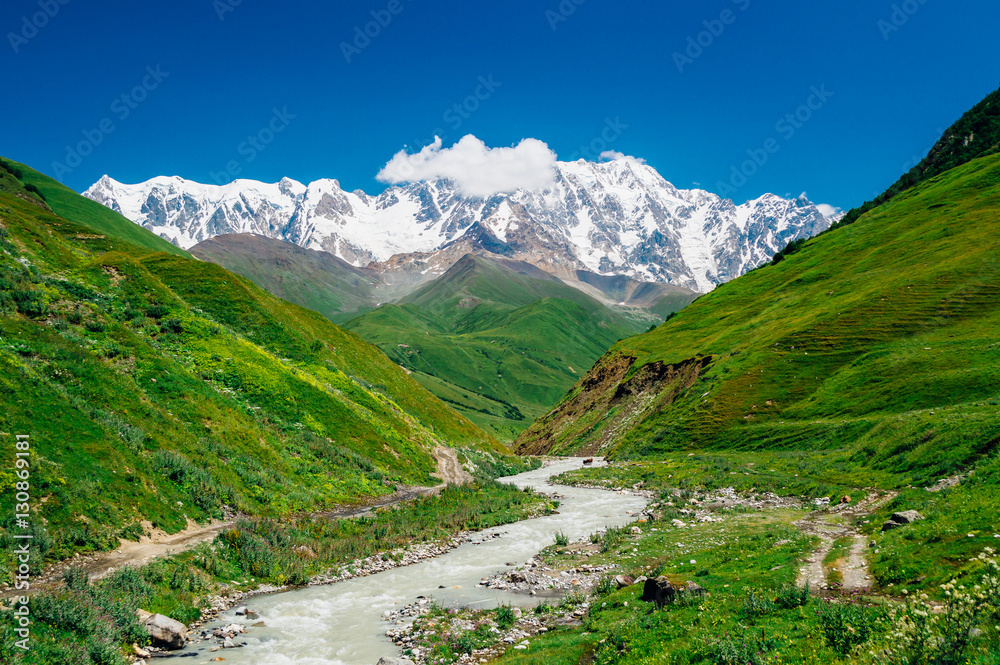 Rocky Caucasus Mountains (Bezengi Wall, Shkhara) with Enguri river landscape in Ushguli, Svaneti, Georgia  