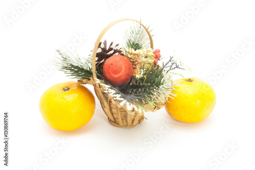 Christmas basket and two ripe tangerine isolated on white background  