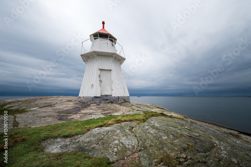 Wooden Light House on a Rock with a sea view
