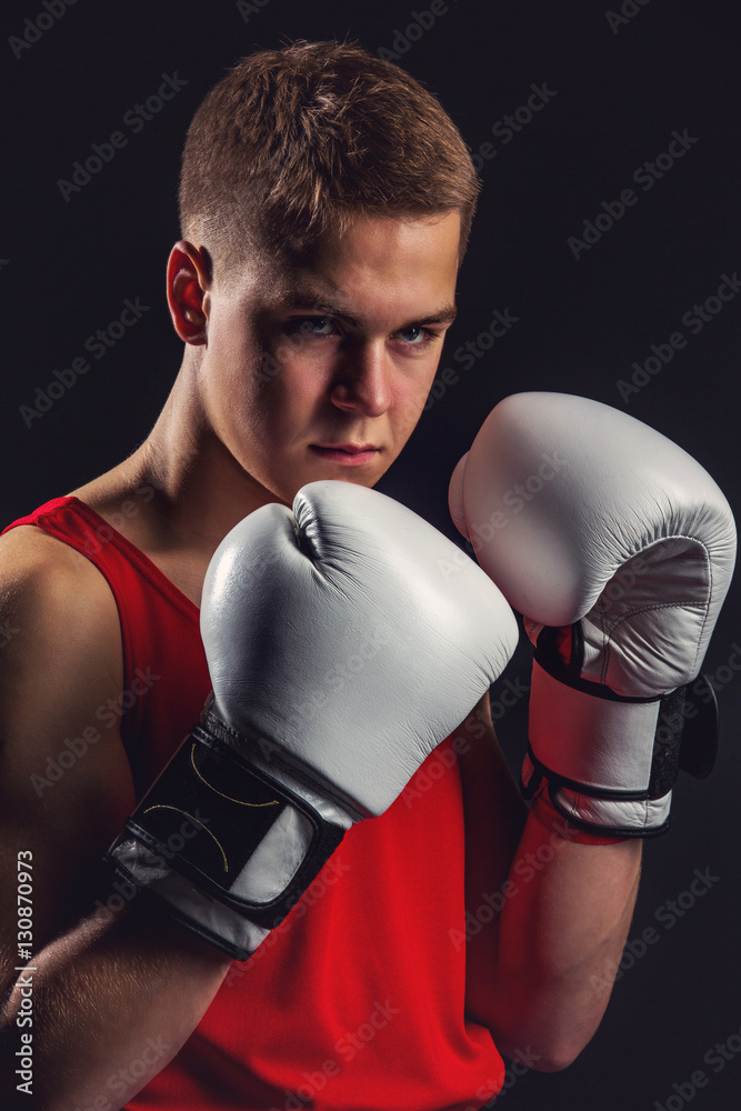 Young boxer sportsman in red sport suit