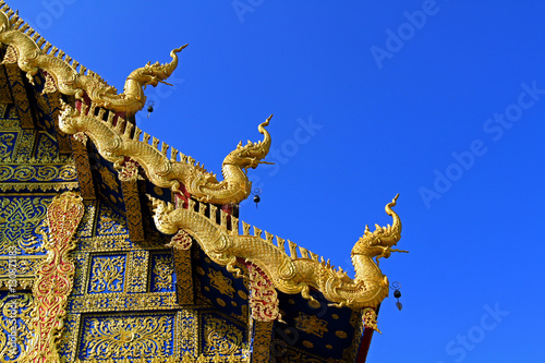 The right roof of Wat Rong Sua Ten at Chiang Rai, Thailand - Buddhist Temple  © Nattasak